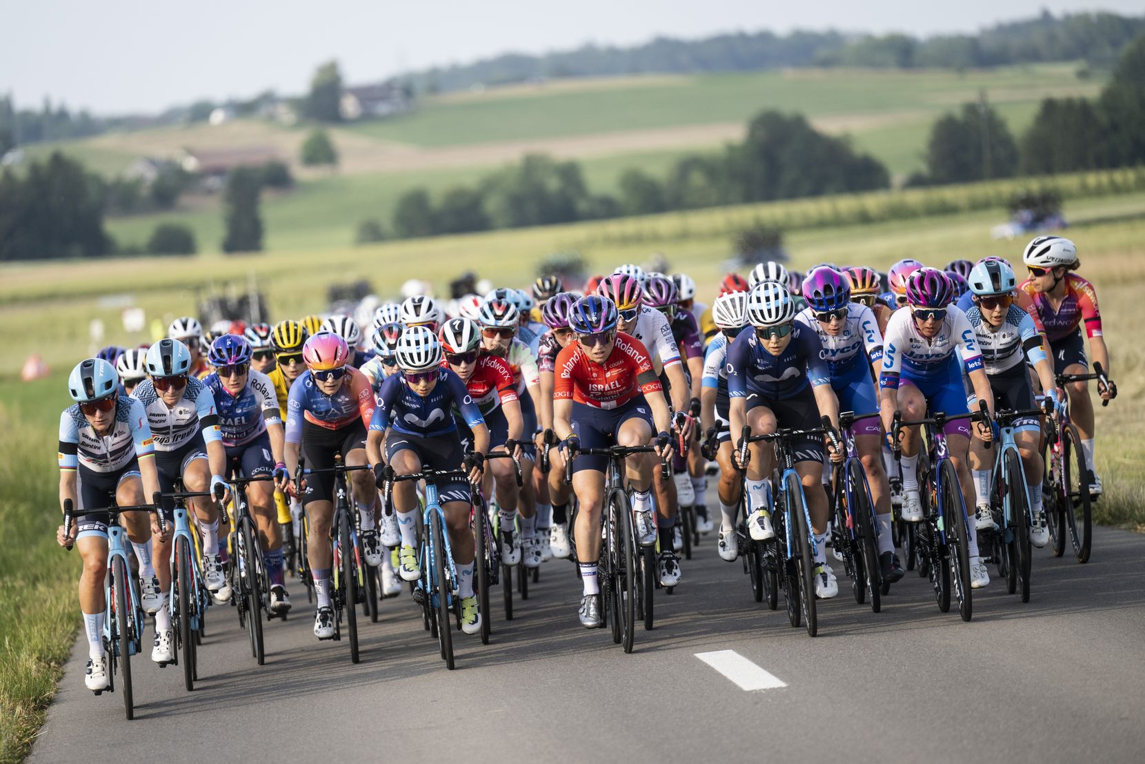 The peloton during the first stage, at the 3rd Tour de Suisse UCI WorldTour cycling women's race, on Saturday, June 17, 2023, in Weinfelden, Switzerland. (KEYSTONE/Gian Ehrenzeller)