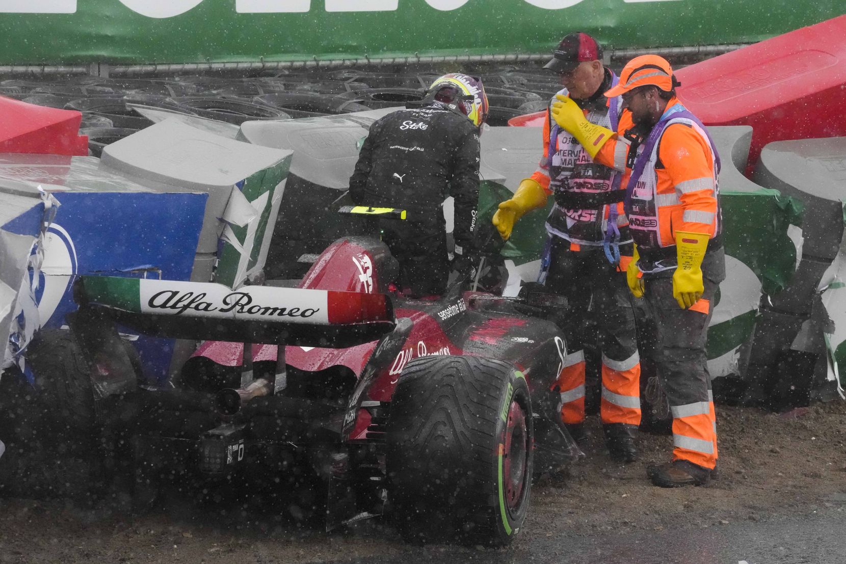 Alfa Romeo driver Guanyu Zhou of China leaves his car after crashing during the Formula One Dutch Grand Prix at the Zandvoort racetrack, in Zandvoort, Netherlands, Sunday, Aug. 27, 2023.(AP Photo/Peter Dejong)