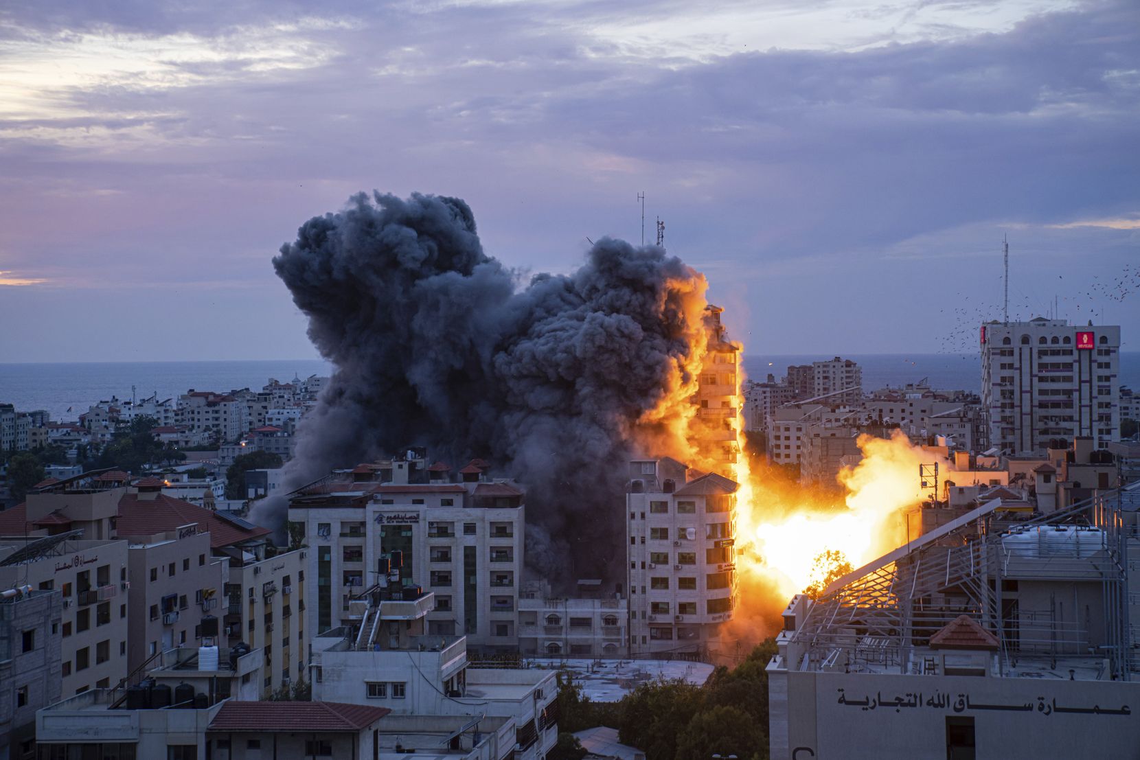 Fire and smoke rise following an Israeli airstrike in Gaza City, Saturday, Oct. 7, 2023. (AP Photo/Fatima Shbair)