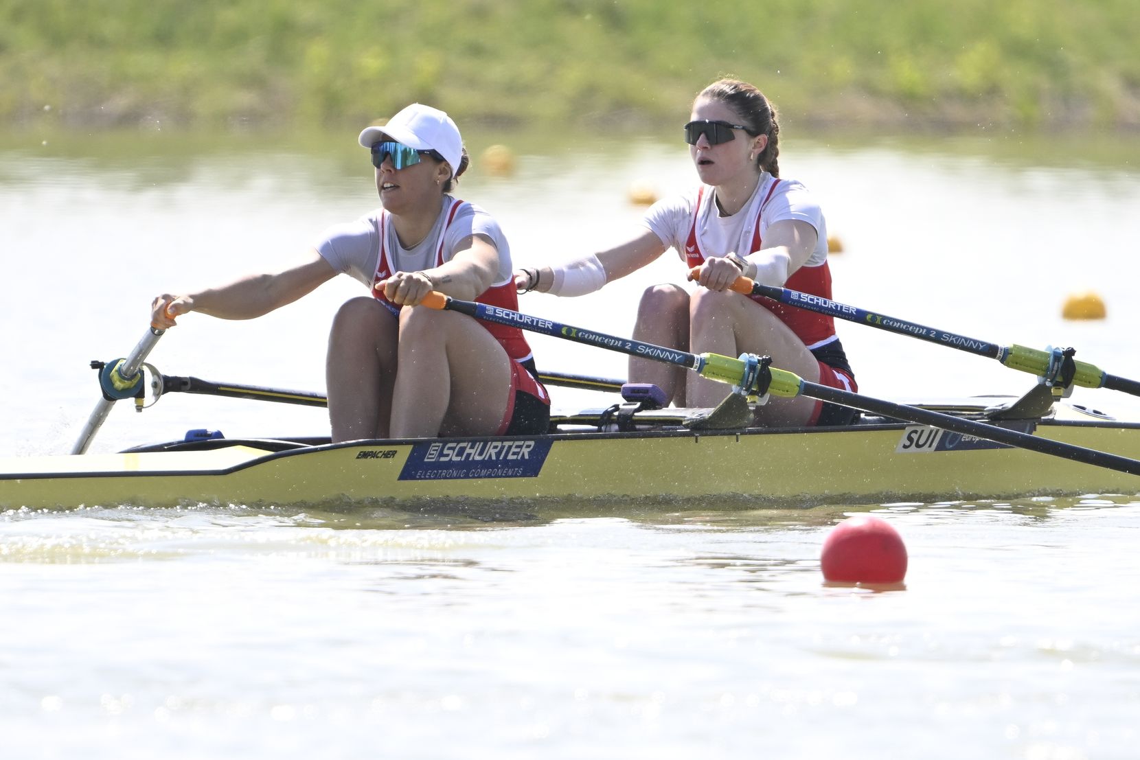 Wettstein Nina and Gmelin Jeannine of Switzerland compete in the women's lightweight double sculls repechage of the European Rowing Championships in Szeged, Hungary, Friday, April 26, 2024. (Tamas Kovacs/MTI via AP)